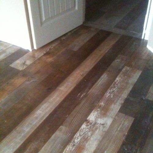 Antique Barn Wood Flooring with Original White Paint Accents