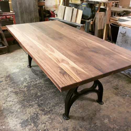 Dining Table in Rustic Walnut with Industrial Cast Iron Base