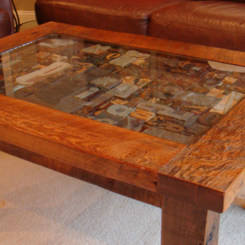 Coffee Table in Antique Reclaimed Pine with Glass Display. Shown with Antique Press Letter Stamps...display your own treasures!