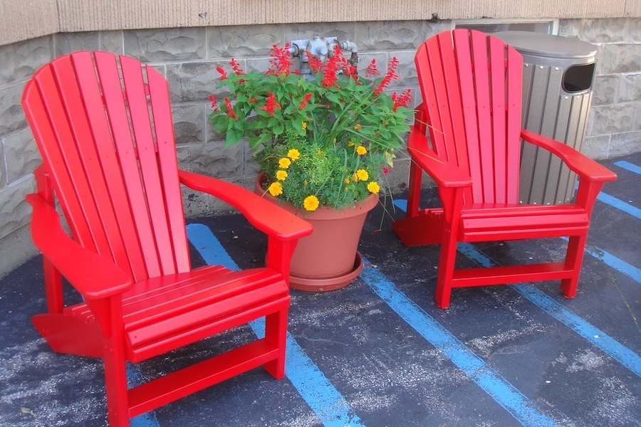 2 red Adirondack chairs