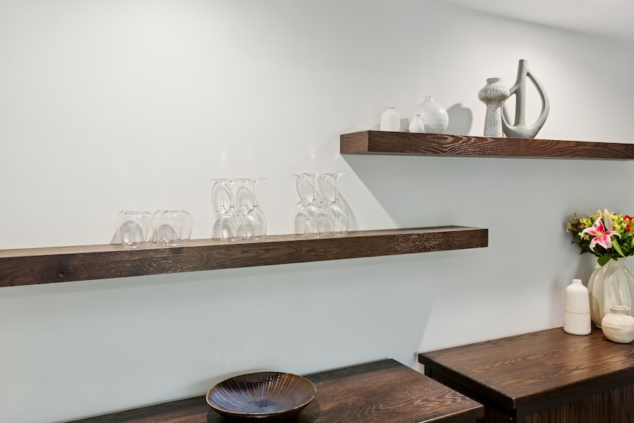 floating shelves with wine glasses and vases