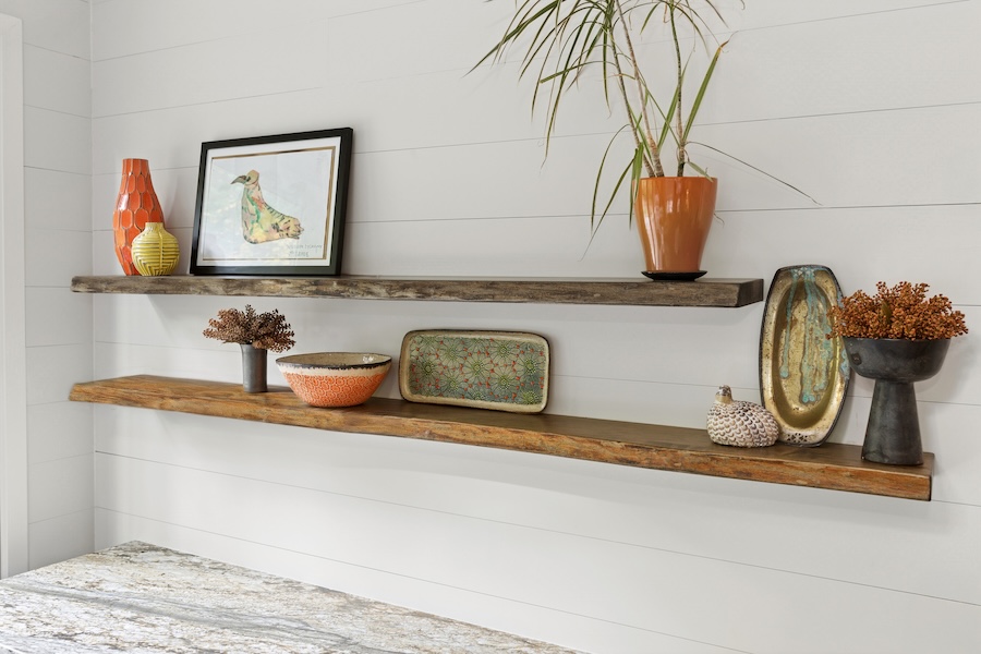 floating shelves with photos and decor