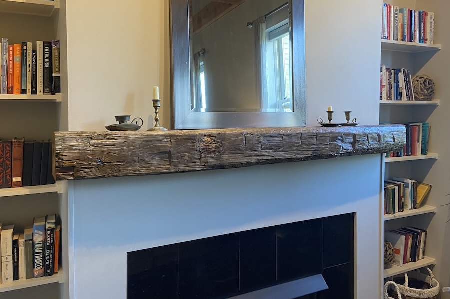 wood mantel above fireplace