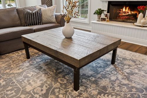 Coffee table in front of fireplace