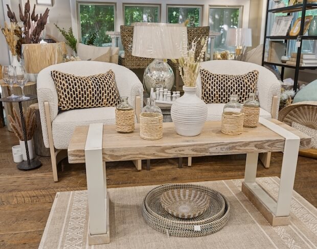 Cozy white chairs with custom coffee table