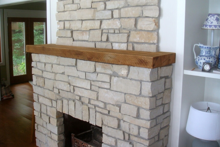 Mantle on stone fireplace