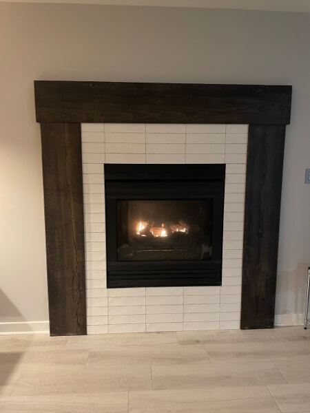 Mantle around white brick fireplace