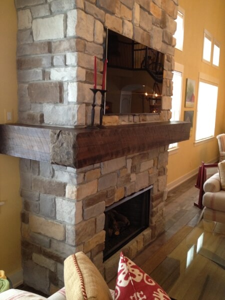 mantle wrapped around stone fireplace