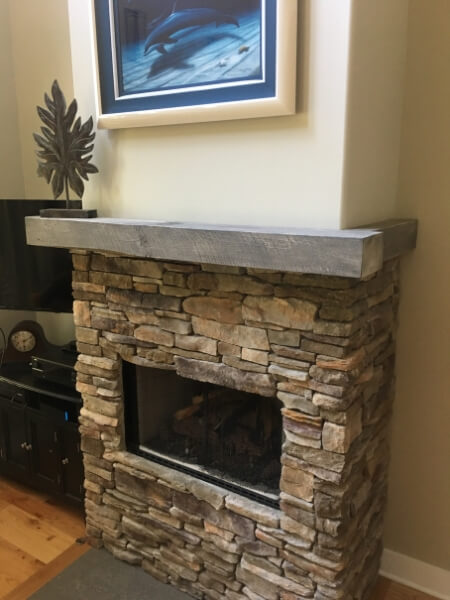 Mantle on stone fireplace
