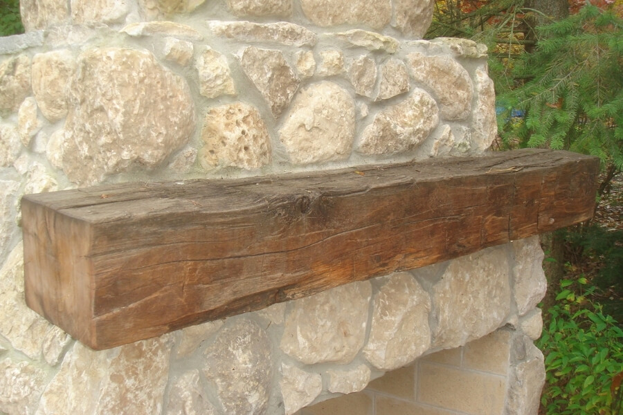 mantle on outdoor stone fireplace