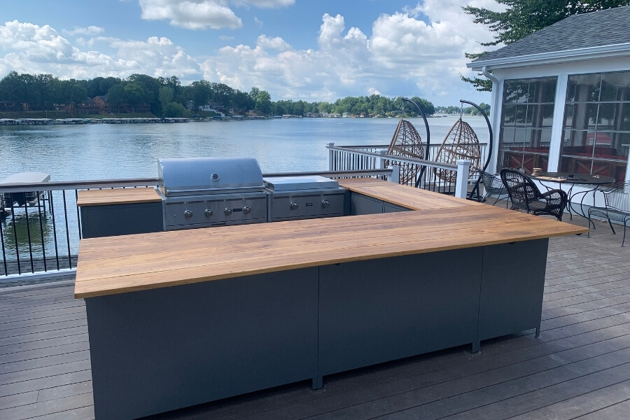 u-shaped outdoor kitchen with wood countertop