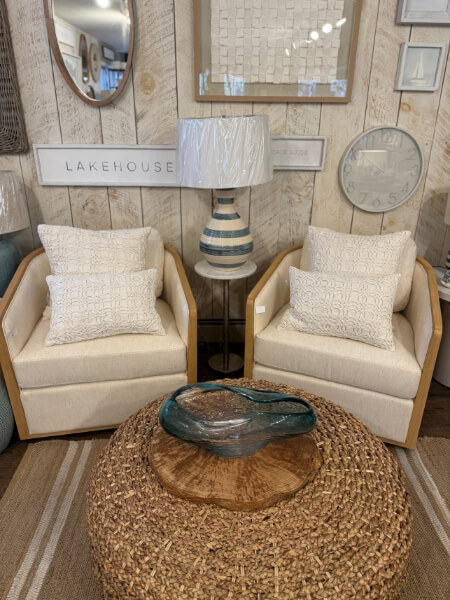 Sitting area with two cozy chairs and ottoman in Hearthwoods showroom