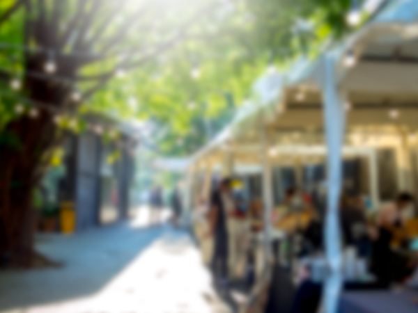outdoor tent with furniture and home goods outside of store